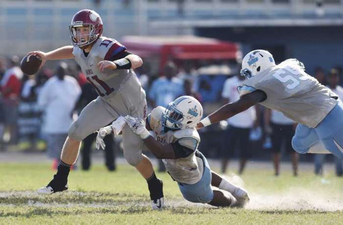 Ribault's defense pressuring Raines QB Augie DeBiase